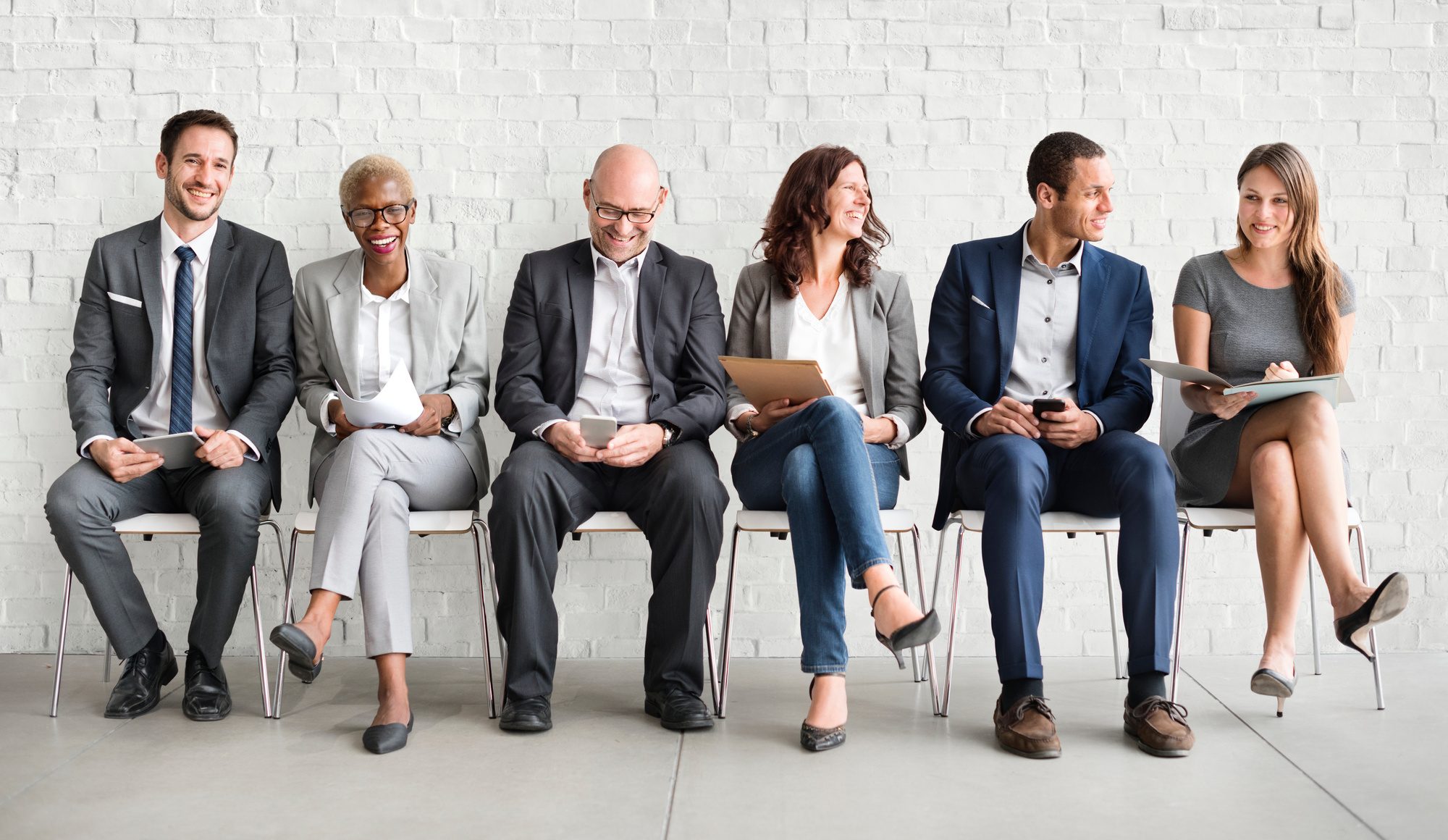 professionals sitting down waiting for interview